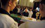 An orthodox believer prays next to the c