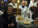 An orthodox believer cries after paying