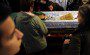 Orthodox believers prays on the casket o